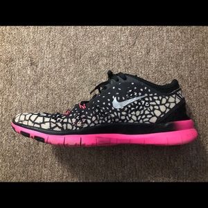 Pink and black Nike running sneakers
